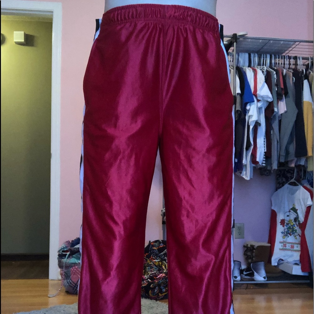red pants with buttons on the side. (never worn)